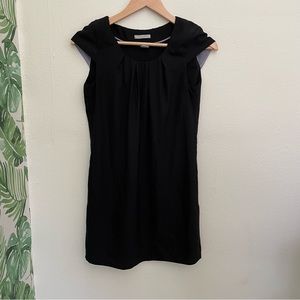 H&M black mini dress with short sleeves.
